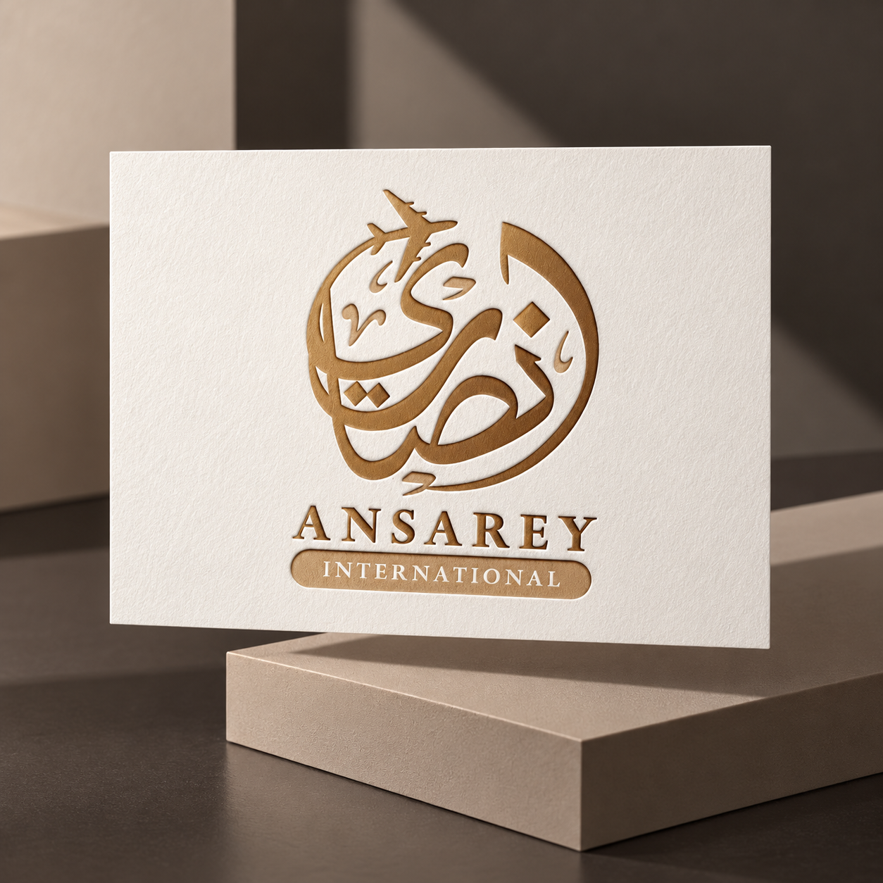 Ansarey International Arabic logo in a contemporary stationery mockup