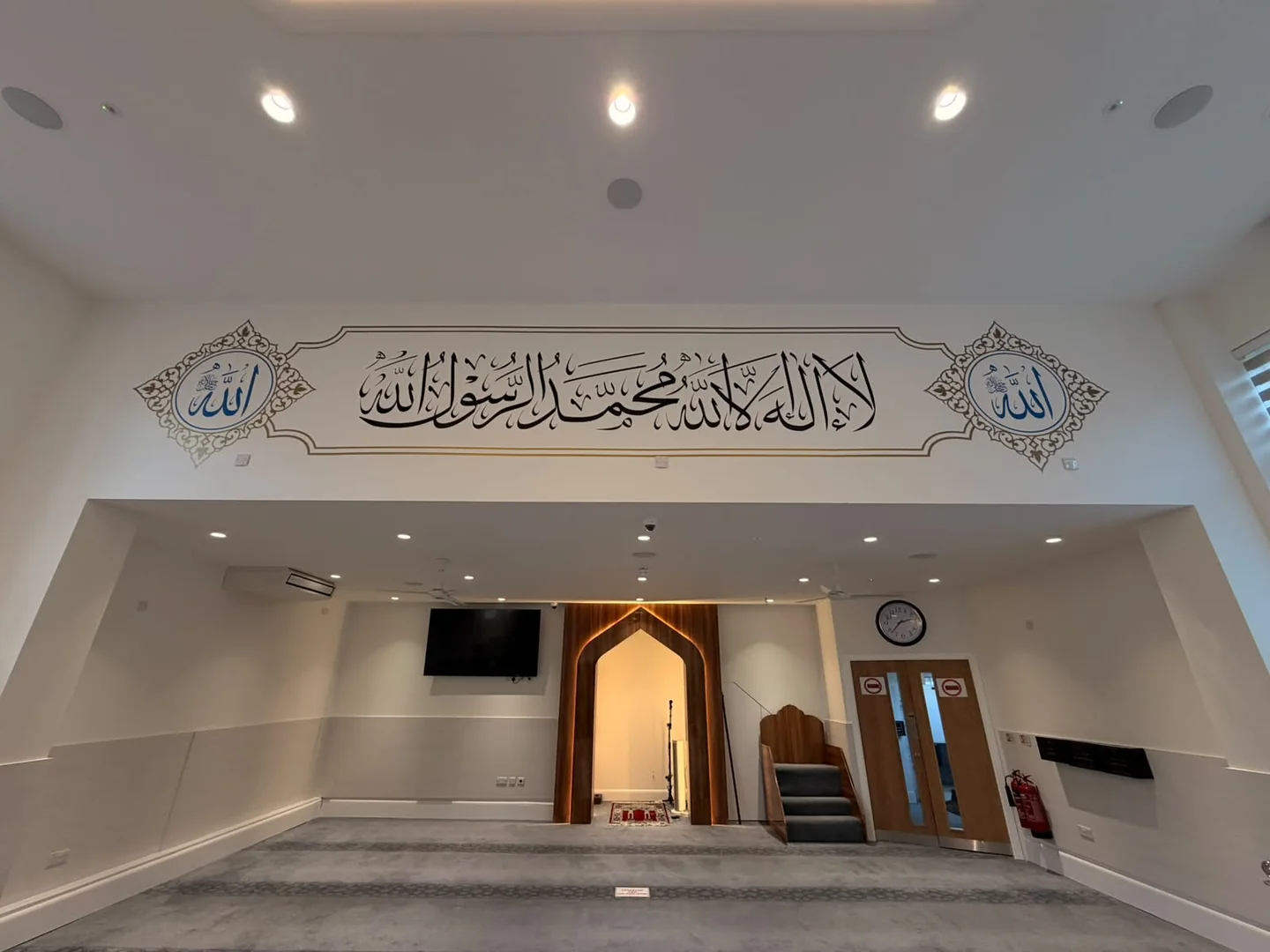 Calligraphy installation above the mosque prayer niche